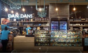 A cozy, inviting corner of Dan Dan's Café in Moonee Ponds, with warm wooden interiors and a delicious spread of brunch dishes.